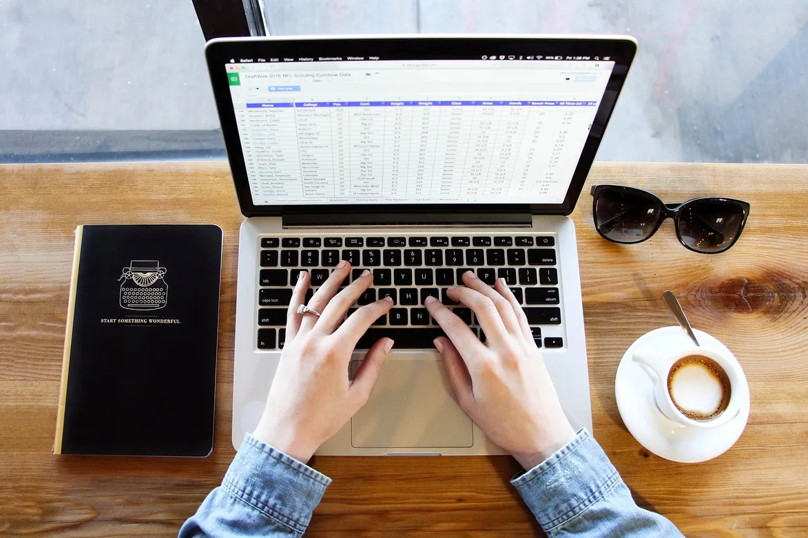 Notebook, typing, coffee